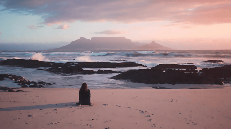 Person-on-beach-at-sunset-with-fast-mode